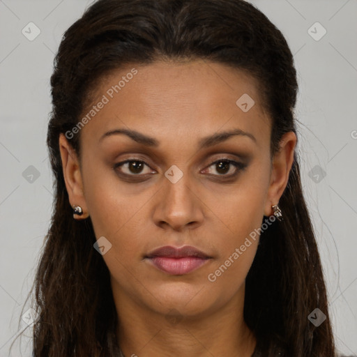 Joyful black young-adult female with long  brown hair and brown eyes