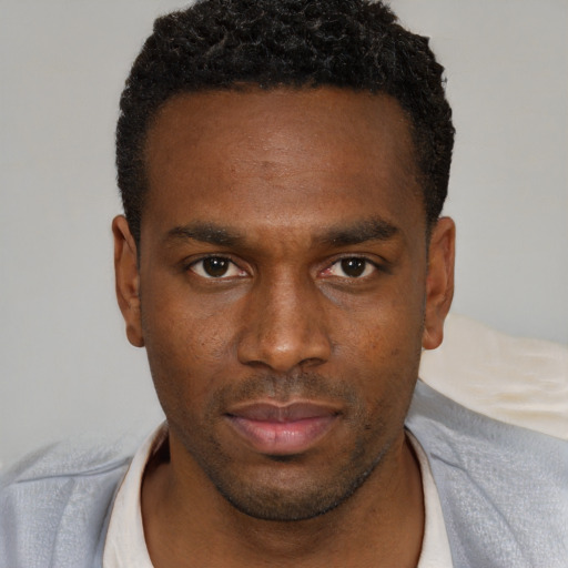 Neutral black young-adult male with short  brown hair and brown eyes