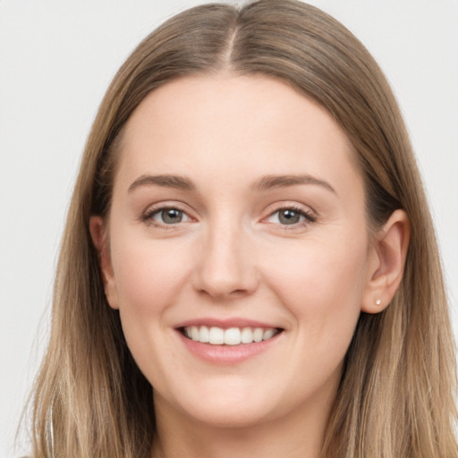 Joyful white young-adult female with long  brown hair and grey eyes