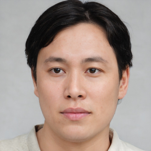 Neutral asian young-adult male with short  brown hair and brown eyes