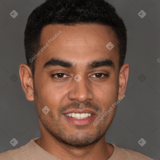 Joyful latino young-adult male with short  brown hair and brown eyes