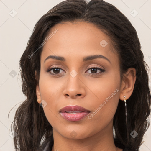 Joyful latino young-adult female with long  brown hair and brown eyes