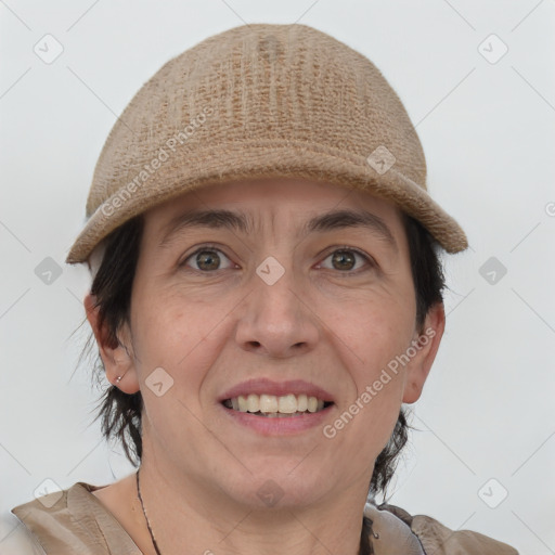 Joyful white adult female with short  brown hair and grey eyes