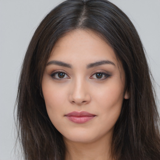Neutral latino young-adult female with long  brown hair and brown eyes