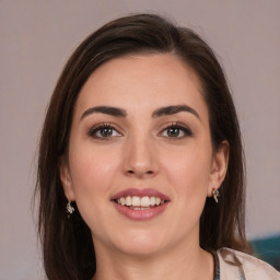 Joyful white young-adult female with medium  brown hair and brown eyes