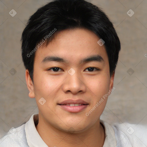 Joyful asian young-adult male with short  black hair and brown eyes