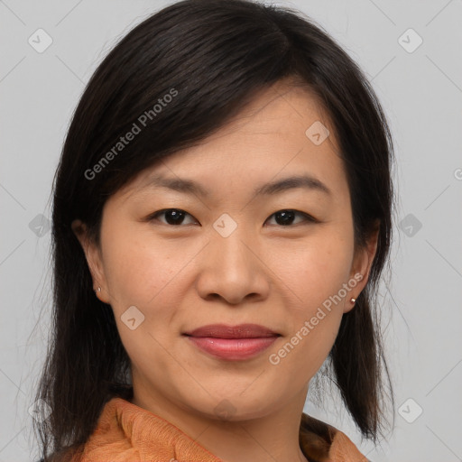 Joyful asian young-adult female with medium  brown hair and brown eyes