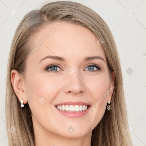 Joyful white young-adult female with long  brown hair and blue eyes