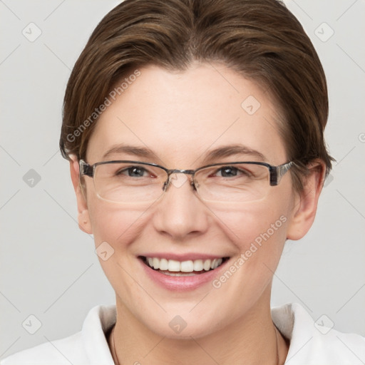 Joyful white adult female with short  brown hair and grey eyes