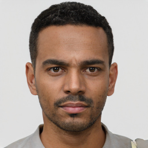 Neutral black young-adult male with short  black hair and brown eyes