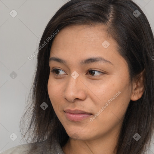 Joyful asian young-adult female with long  brown hair and brown eyes