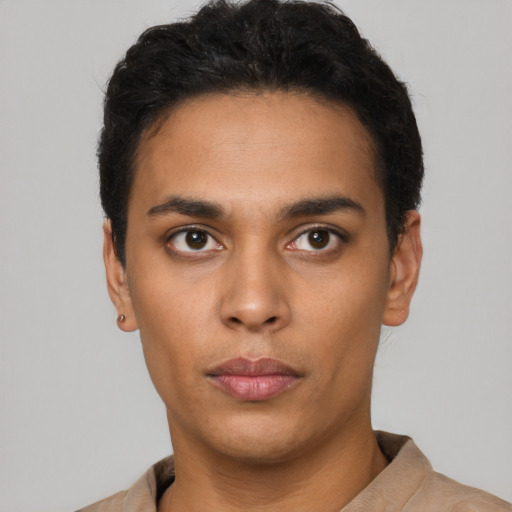 Neutral latino young-adult male with short  black hair and brown eyes