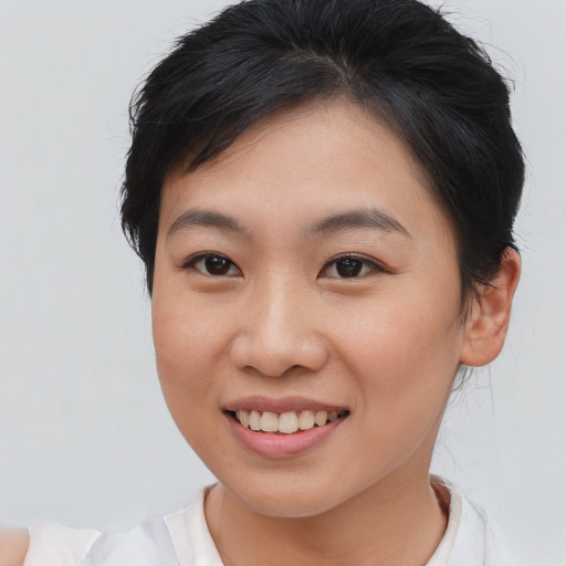 Joyful asian young-adult female with medium  brown hair and brown eyes