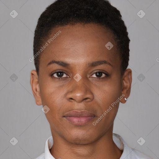 Joyful black young-adult female with short  brown hair and brown eyes