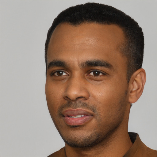 Neutral black young-adult male with short  black hair and brown eyes