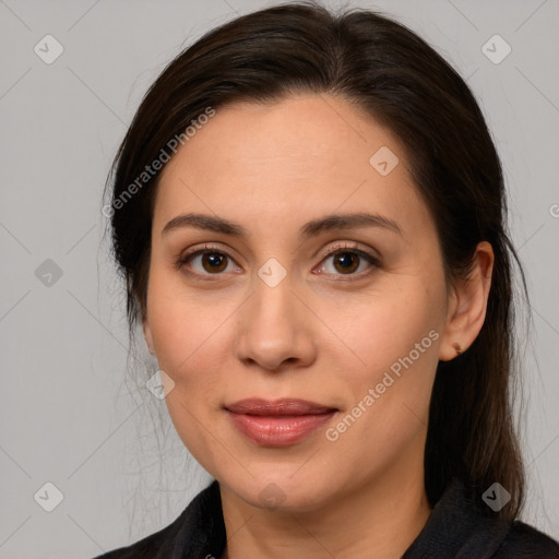 Joyful white adult female with medium  brown hair and brown eyes