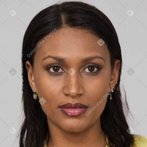 Joyful black young-adult female with long  brown hair and brown eyes