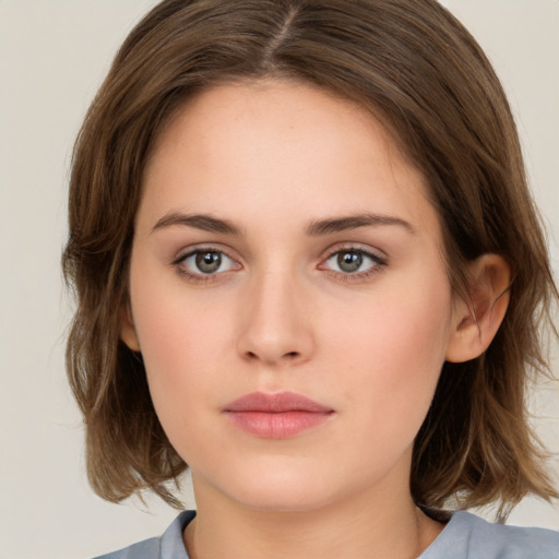 Neutral white young-adult female with medium  brown hair and brown eyes