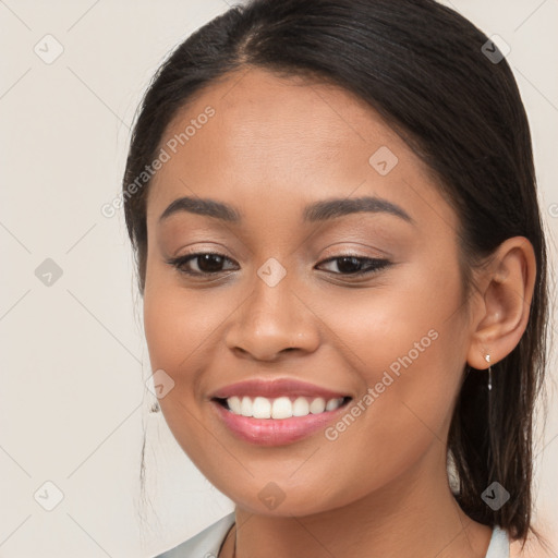 Joyful white young-adult female with long  brown hair and brown eyes