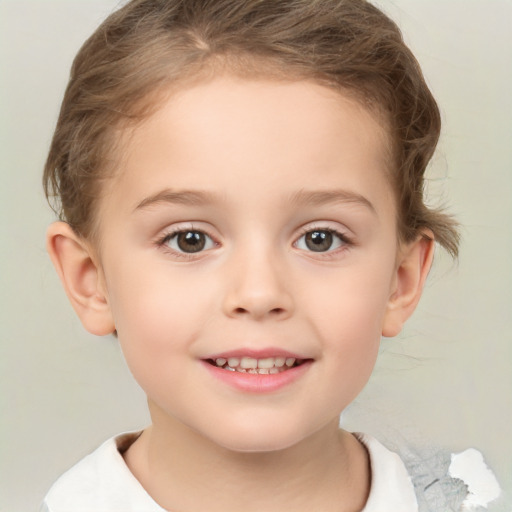 Joyful white child female with short  brown hair and brown eyes