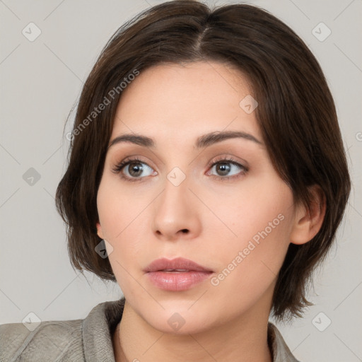 Neutral white young-adult female with medium  brown hair and brown eyes