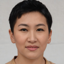 Joyful asian young-adult female with short  black hair and brown eyes