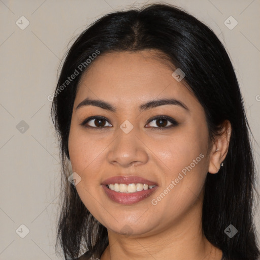 Joyful latino young-adult female with long  brown hair and brown eyes