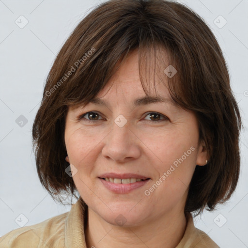 Joyful white adult female with medium  brown hair and brown eyes