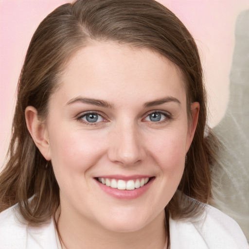 Joyful white young-adult female with medium  brown hair and blue eyes