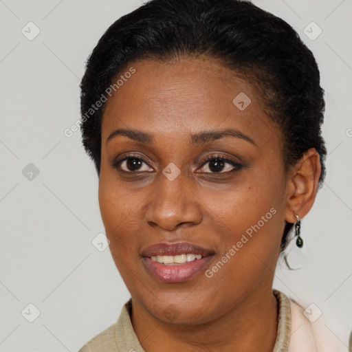 Joyful black adult female with short  brown hair and brown eyes