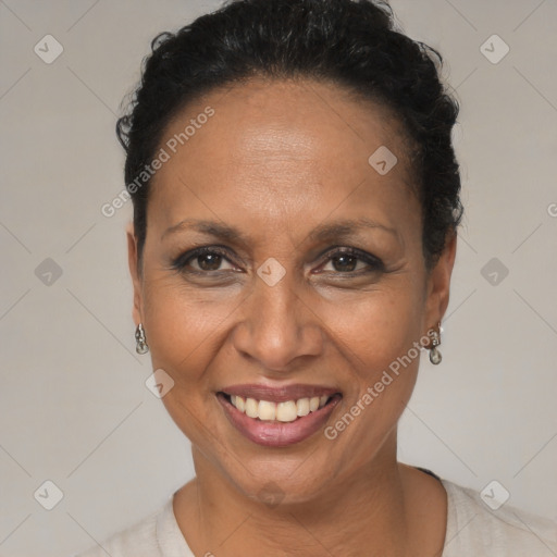 Joyful black adult female with short  brown hair and brown eyes