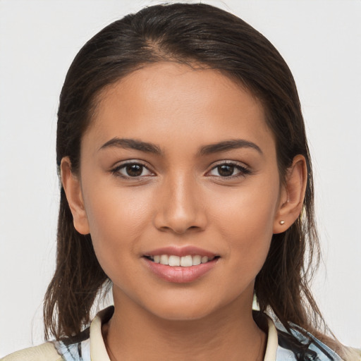 Joyful white young-adult female with long  brown hair and brown eyes