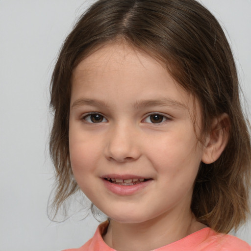 Joyful white child female with medium  brown hair and brown eyes