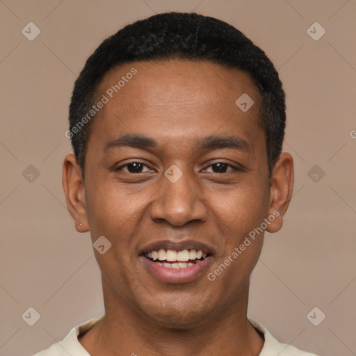 Joyful black young-adult male with short  black hair and brown eyes