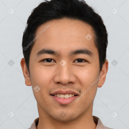 Joyful asian young-adult male with short  brown hair and brown eyes