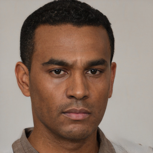 Neutral black young-adult male with short  brown hair and brown eyes