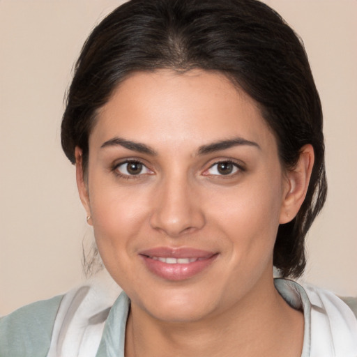 Joyful white young-adult female with medium  brown hair and brown eyes