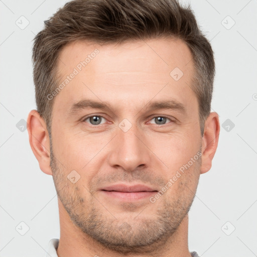 Joyful white adult male with short  brown hair and brown eyes