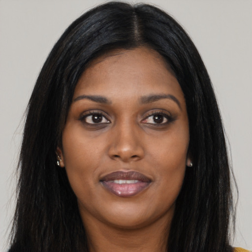 Joyful asian young-adult female with long  black hair and brown eyes