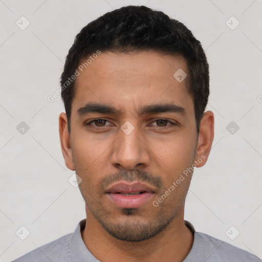 Neutral latino young-adult male with short  black hair and brown eyes