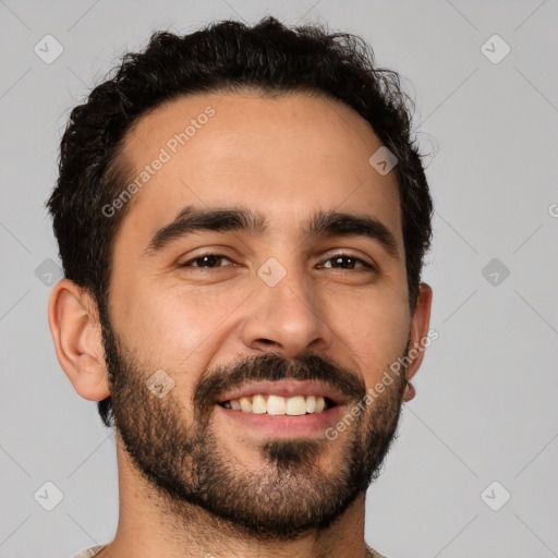 Joyful latino young-adult male with short  black hair and brown eyes