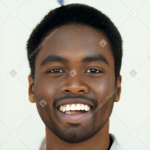 Joyful black young-adult male with short  brown hair and brown eyes