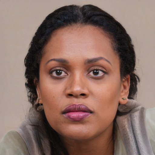 Neutral black young-adult female with long  brown hair and brown eyes