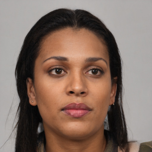 Neutral black young-adult female with long  brown hair and brown eyes