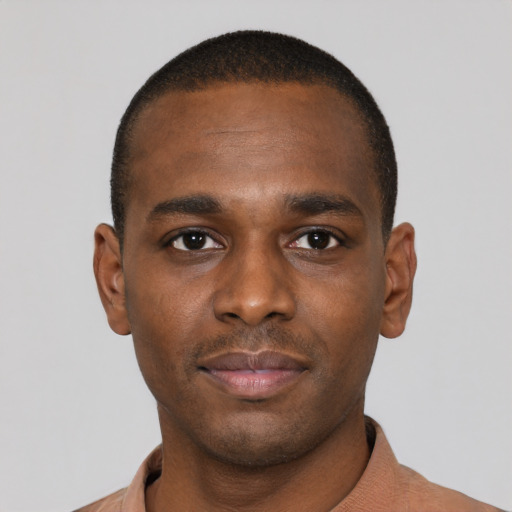 Neutral latino young-adult male with short  brown hair and brown eyes