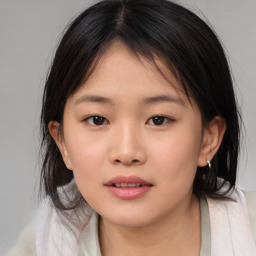 Neutral asian young-adult female with medium  brown hair and brown eyes