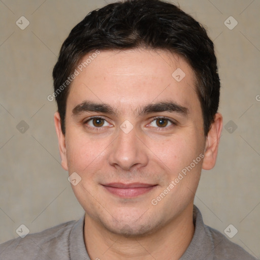 Joyful white young-adult male with short  black hair and brown eyes