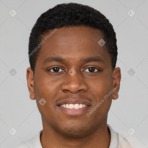 Joyful black young-adult male with short  brown hair and brown eyes