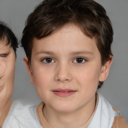 Joyful white child female with short  brown hair and brown eyes