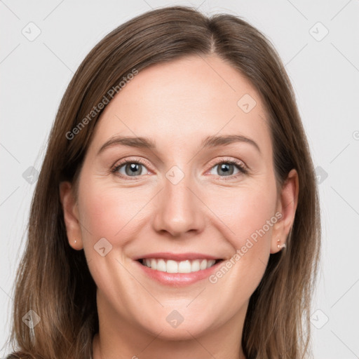 Joyful white young-adult female with long  brown hair and grey eyes